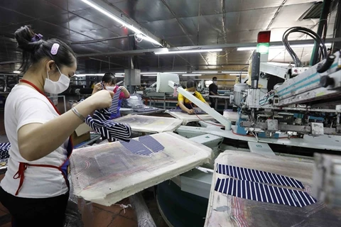 Garments are made by workers of An Phu Printing & Garment Export Co in Hung Yen province. (Photo: VNA)