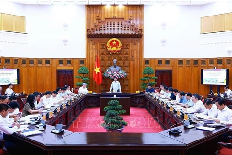 PM Pham Minh Chinh chairs the meeting on the North - South high-speed railway project and the implementation of railway projects connecting with China on October 5. (Photo: VNA)