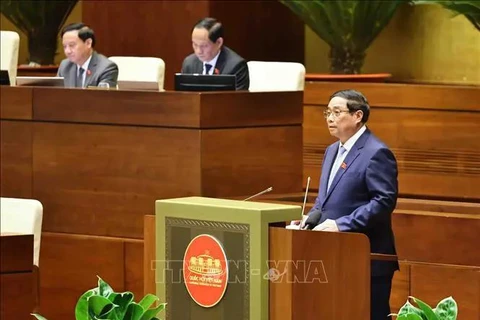 PM Pham Minh Chinh fields legislators' questions at the 15th NA's ongoing 8th session on November 12. (Photo: VNA)