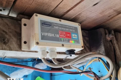 A journey monitoring device installed on a fisherman's boat. (Photo: VNA)