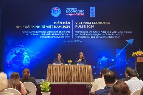 Ramla Khalidi, United Nations Development Programme (UNDP), and Tran Thi Hong Minh, President of the Central Institute for Economic Management. (Photo: VNA) 