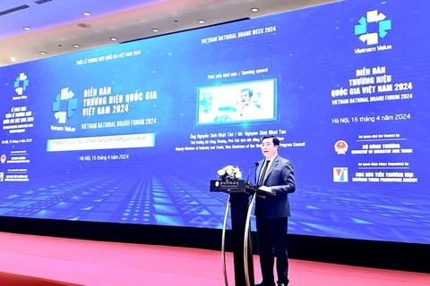 Deputy Minister of Industry and Trade Nguyen Sinh Nhat Tan addresses the National Brand Forum held by the Ministry of Industry and Trade in Hanoi on April 16 (Photo: VietnamPlus)