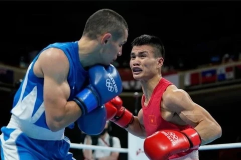 Le boxeur vietnamien Nguyên Van Duong (maillot rouge). Photo: Báo Thể thao & Văn hóa