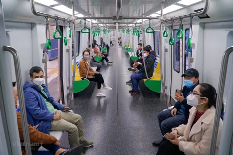 Passengers on the Nhon-Hanoi Station metro line. Photo: VNA)