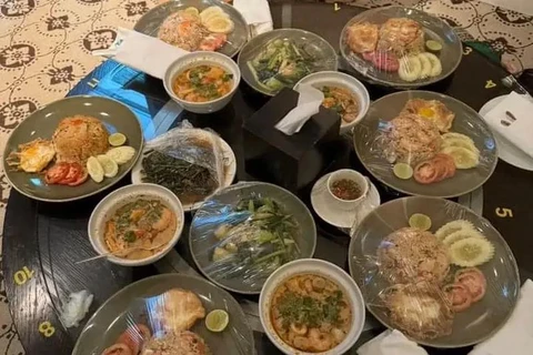 Photos of food in the room where the murder-suicide occurred showed that some plates had their plastic wrap removed. (Photo: VietnamPlus)