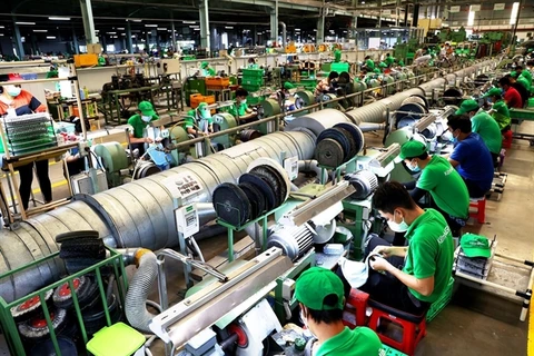 A company in HCM City. With new orders rising sharply, manufacturers ramped up production in July. (Photo: VNA)