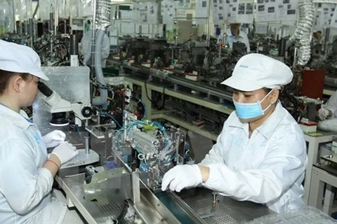 Manufacturing electronic components at Japan-based Nidec Sankyo Ltd Co., Ltd in HCM City's Saigon Hi-Tech Park. (Photo: VNA)