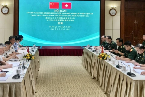 At the talks between the Vietnam Border Guard High Command and the National Immigration Administration of China in Hanoi on August 12. (Photo: VNA)