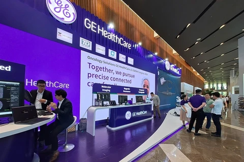 An exhibition of AI tech in heathcare opens in Da Nang city. More than 400 experts, doctors and AI tech companies shared solutions for wider use of AI in healthcare service. (Photo: VNA)