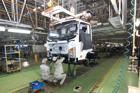 Workers assembling car parts at a plant of VEAM in Thanh Hoa province (Photo: VNA)