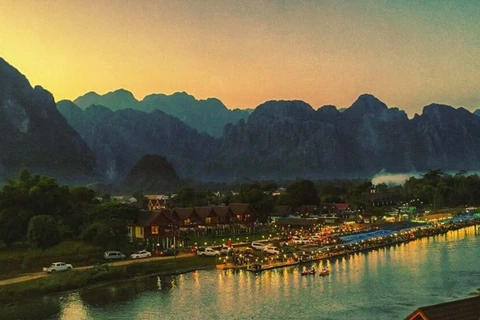 Vang Vieng is a town in the Lao province of Vientiane, about halfway to Luang Prabang, known for its picturesque views, limestone cliffs and caves. (Photo: laotiantimes.com)