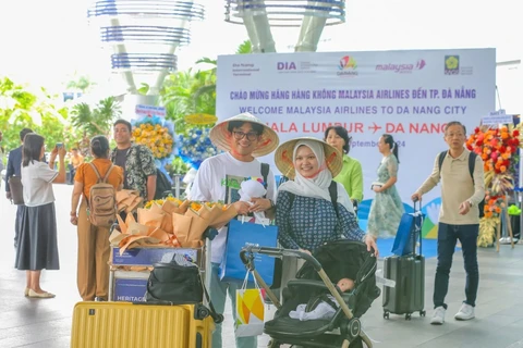 The passengers of Malaysia Airlines' flight MH748 at Da Nang International Airport. (Photo: VNA)