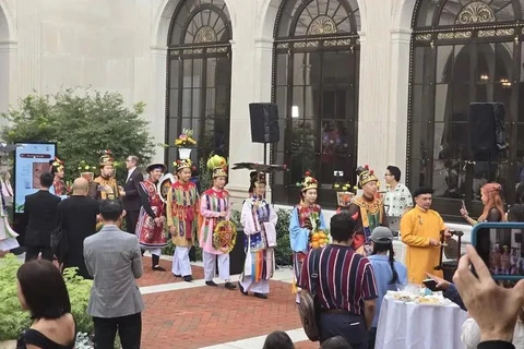 The reenactment of a royal procession in the late 19 century at the National Museum of Asian Art. (Photo: VNA)