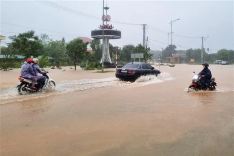 Heavy rain due to the impact of Typhoon Trami causes flooding on a road in Cam Thanh commune, Cam Lo district, Quang Tri province. (Photo: VNA)