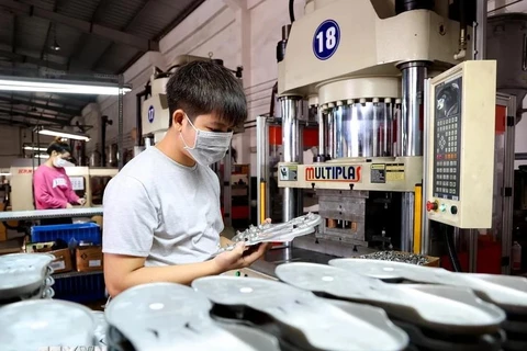 Workers at an industrial park - Illustrative image (Photo: VNA)