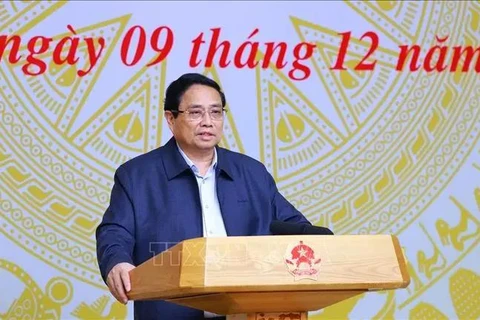 Prime Minister Pham Minh Chinh, who is also Chairman of the Central Emulation and Commendation Council, chairs its 10th meeting Hanoi on December 9. (Photo: VNA)