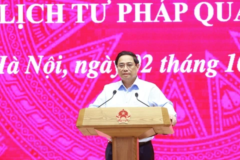 Prime Minister Pham Minh Chinh speaks at the online conference to implement the expansion of the electronic health record system and the issuance of judicial record certificates via the app VNeID nationwide. (Photo: VNA)