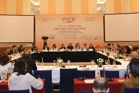 Filmmakers, experts, actors and actresses from Vietnam and Germany at the workshop to share experience in developing the cinema industry. (Photo: VNA)