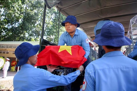 The ceremony on June 28 to receive the remains of 172 Vietnamese volunteer soldiers who fell down in Cambodia during the wartime. (Photo: VNA)