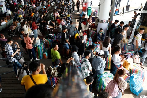 Holidaymakers wait to take buses to their hometowns during the Songkran long holiday in April this year, at Mo Chit bus terminal in Bangkok. (Photo: Bangkok Posts) 