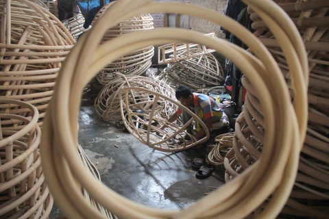 Workers put finishing touches on beach chairs made from rattan in Tegal Wangi, Cirebon, West Java. (Photo: Antara)