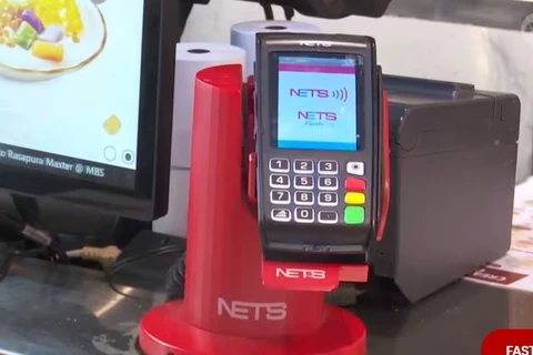 A NETS payment machine. (Photo: channelnewsasia.com) 