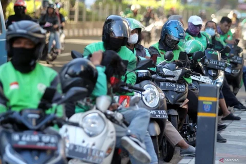 Indonesia is moving to protect online motorcycle taxi drivers. (Photo: cdn.antaranews.com)