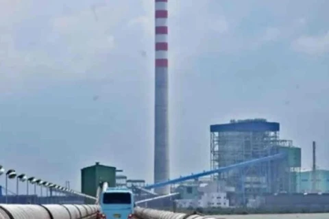 A bus travels near the Cirebon-1 coal-fired power plant on Oct. 18, 2020, in Cirebon, West Java. Indonesia, home to the world's fourth-biggest population, is one of world’s largest thermal coal exporters and carbon emitters. (Photo: Antara) 