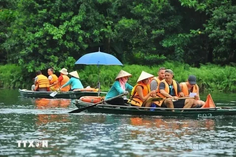 Foreign tourists visit Trang An Scenic Landscape Complex, Ninh Binh (Photo: VNA)