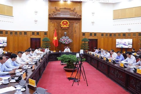 PM Pham Minh Chinh chairs a meeting with ministries, sectors and localities on power supply in 2024. (Photo: VNA)