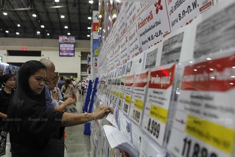 A visitor browses travel promotions at a travel fair in Nonthaburi province. (Photo: Bangkok Post)