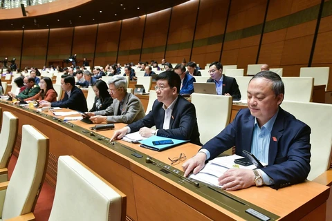 Most of the delegates present at the 15th NA's 8th sitting voting in favour of the revised Trade Union Law. (Photo: VNA)