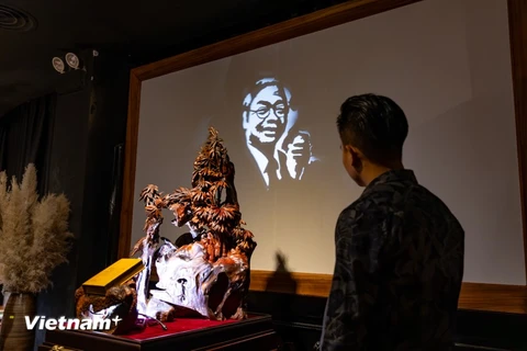 Portrait of Party leader illuminated through light sculpture