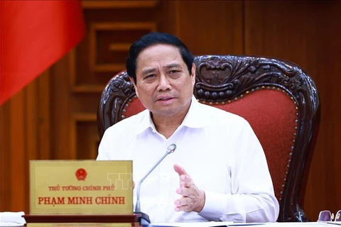 Le Premier ministre Pham Minh Chinh lors de la réunion, à Hanoi, le 17 mai. Photo: VNA