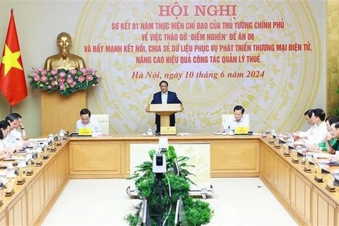 Le Premier ministre Pham Minh Chinh lors de la conférence. Photo:! VNA