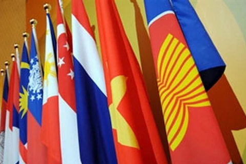 The ASEAN flag (R) and the flags of the bloc's member nations (Photo: AFP)
