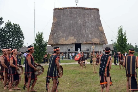 J'rai youth perform gongs at a traditional festival.