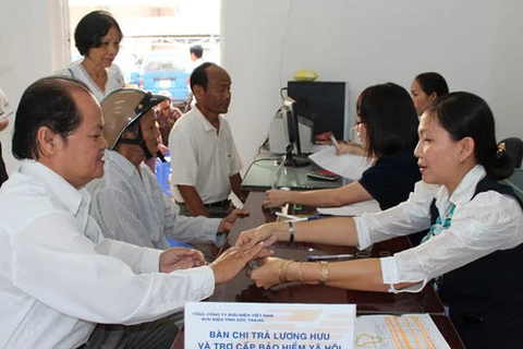 HCM City: More districts launch pension payment service via post