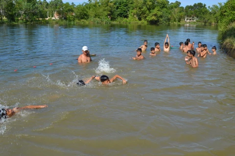 Children in Quang Ngai taught swimming skills in river