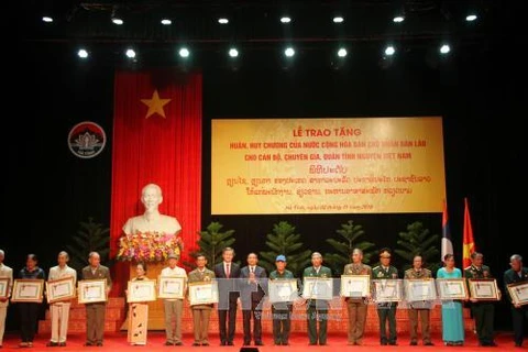 Laos honours Vietnamese voluntary soldiers, experts