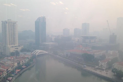 Singapore closes schools as haze conditions worsen