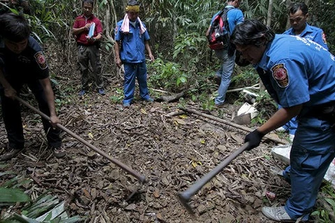 Mass graves found in Malay-Thai border