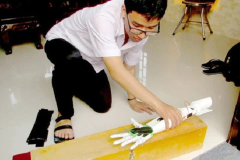 Student invents robotic arm for the disabled