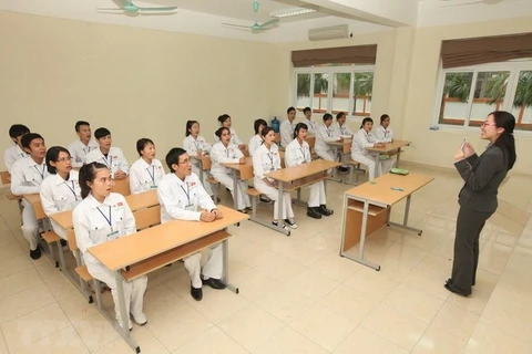 Vietnamese nurse and caregiver candidates study Japanese before arriving in Japan for working (Photo: VietnamPlus)