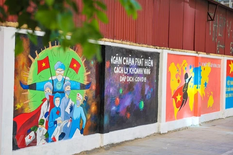 Murals on Hanoi street encourage public to join hands in COVID-19 fight