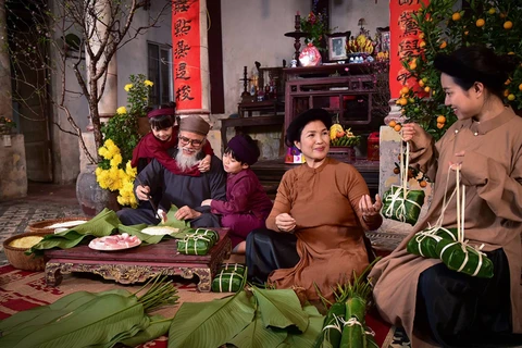 Vietnamese people preserving cultural values of traditional Tet