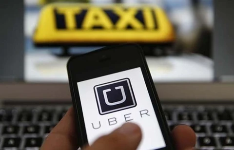 Taxi company Uber Vietnam cuts fares