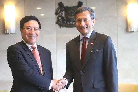Deputy PM Pham Binh Minh on official visit to Singapore