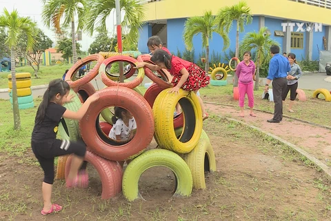 Children have fun with playgrounds from recycle materials