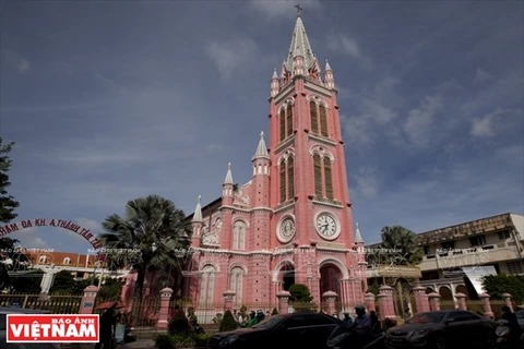 Touring the pinky church in downtown Ho Chi Minh City
